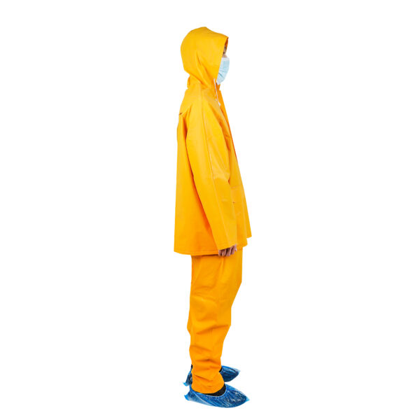 Person in yellow raincoat and mask, side view.