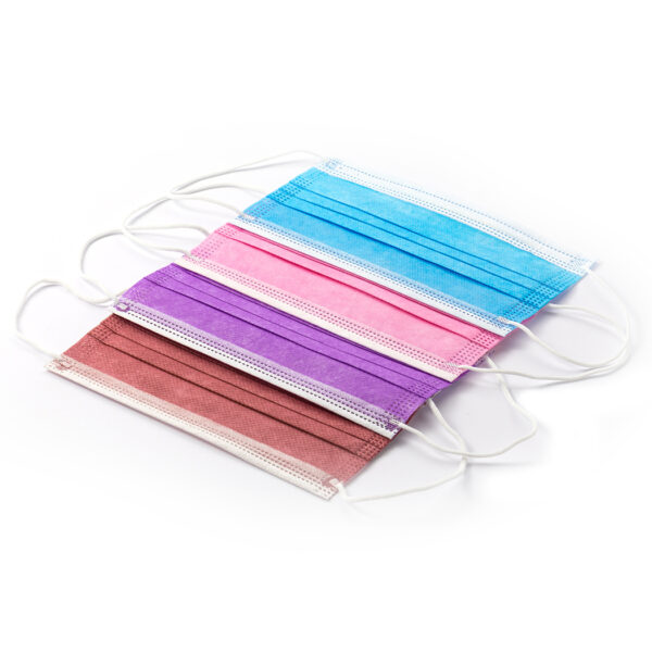 Multicolored disposable face masks on white background.