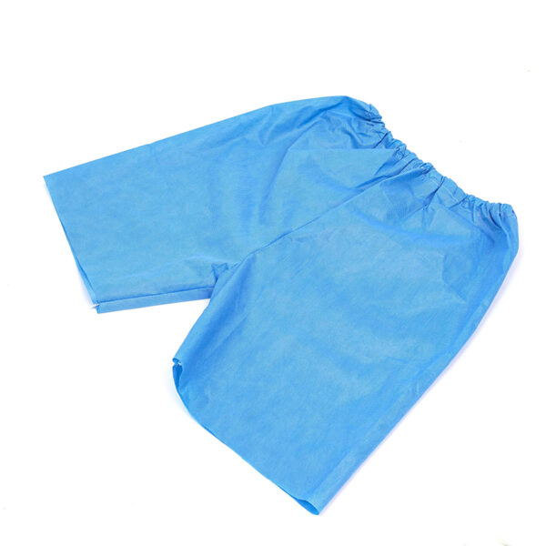 Blue disposable medical shorts with elastic waistband.