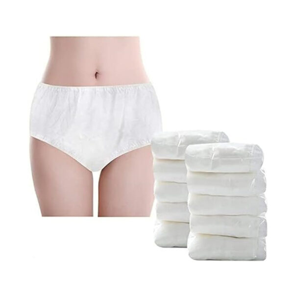 Woman wearing adult diapers, stack of diapers nearby