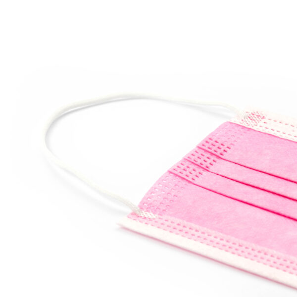 Pink disposable face mask on white background.