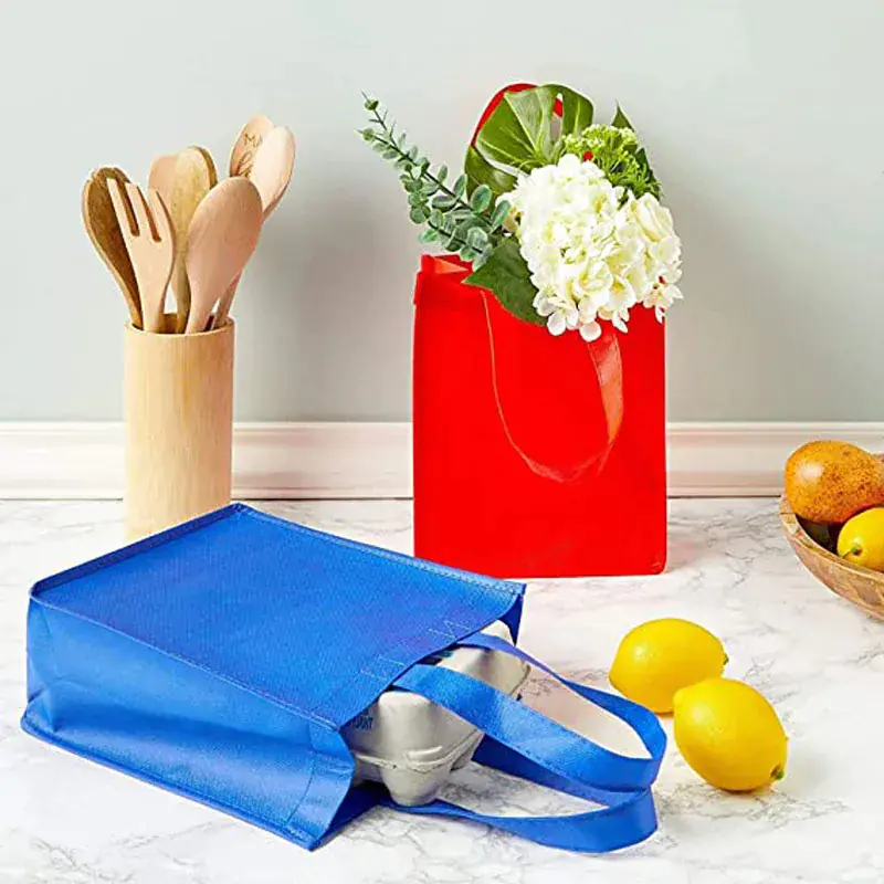Reusable bags with groceries and kitchen utensils