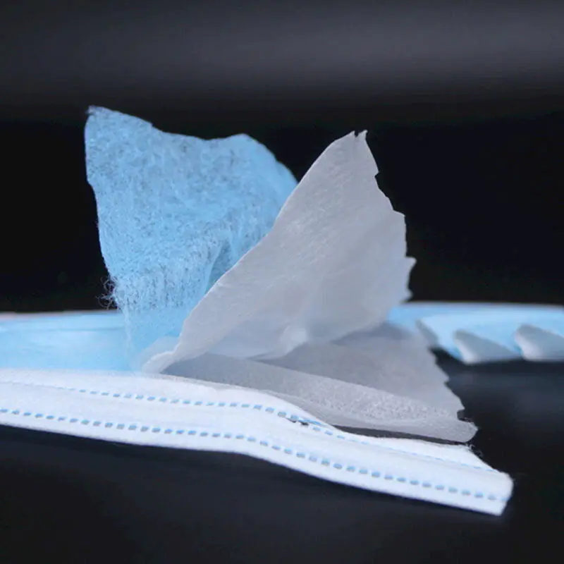 Layers of surgical face mask material close-up.