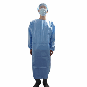 Person wearing protective blue gown and mask.