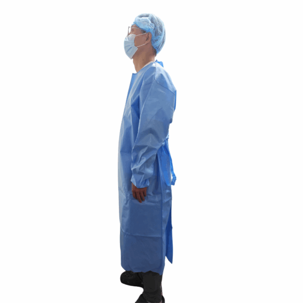Person wearing blue medical gown and mask side view.