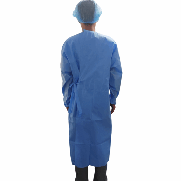 Person wearing blue medical gown and cap