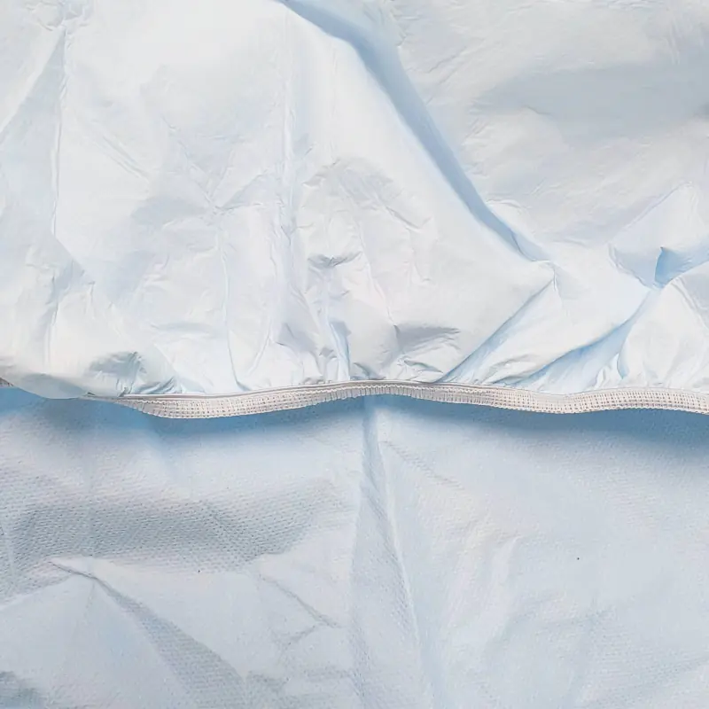 Close-up of a light blue fitted sheet fabric.