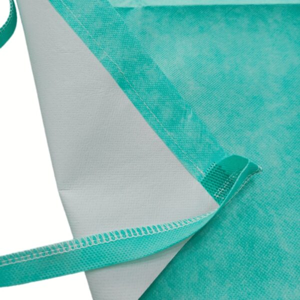 Close-up of turquoise non-woven shopping bag edges.