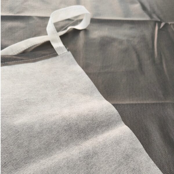 Close-up of a textured gray fabric backdrop.