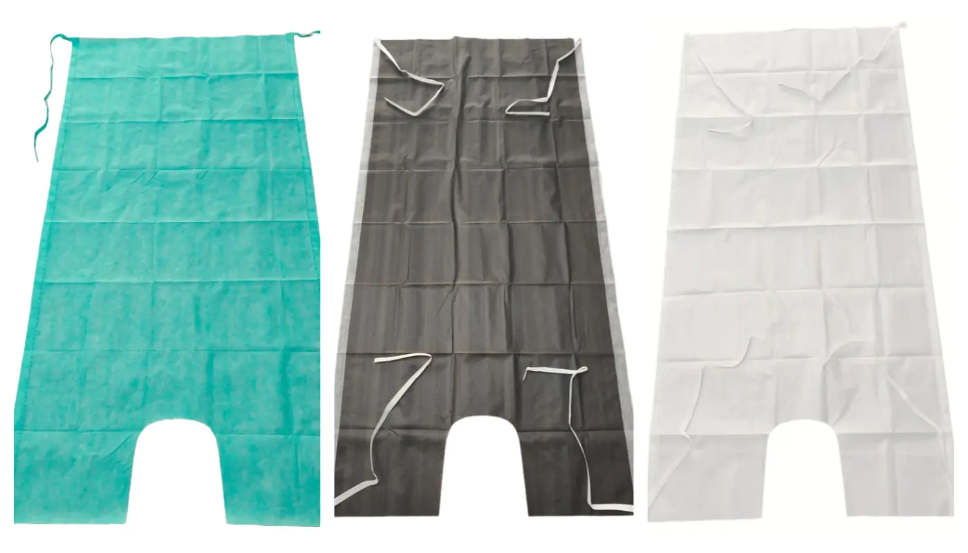 Three disposable aprons in teal, black, and white.