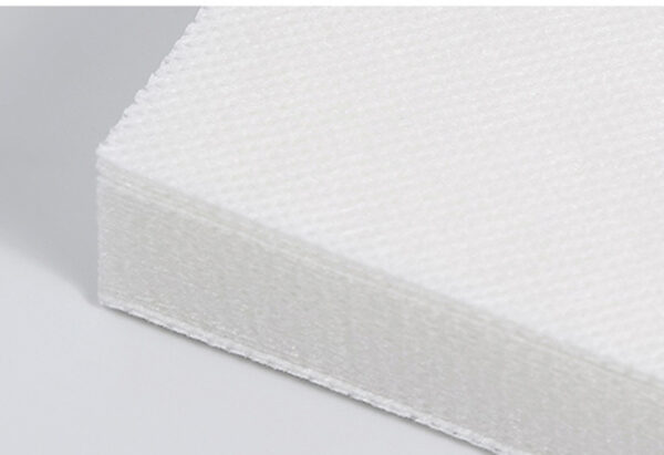 Close-up of white nonwoven fabric stack