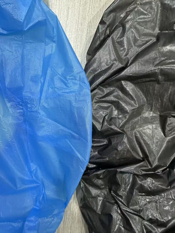 Blue and black fabric on wooden surface.