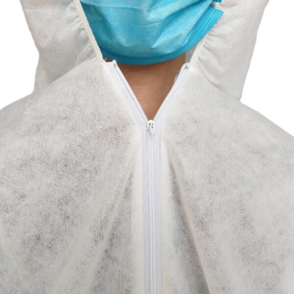 Person wearing protective suit and mask